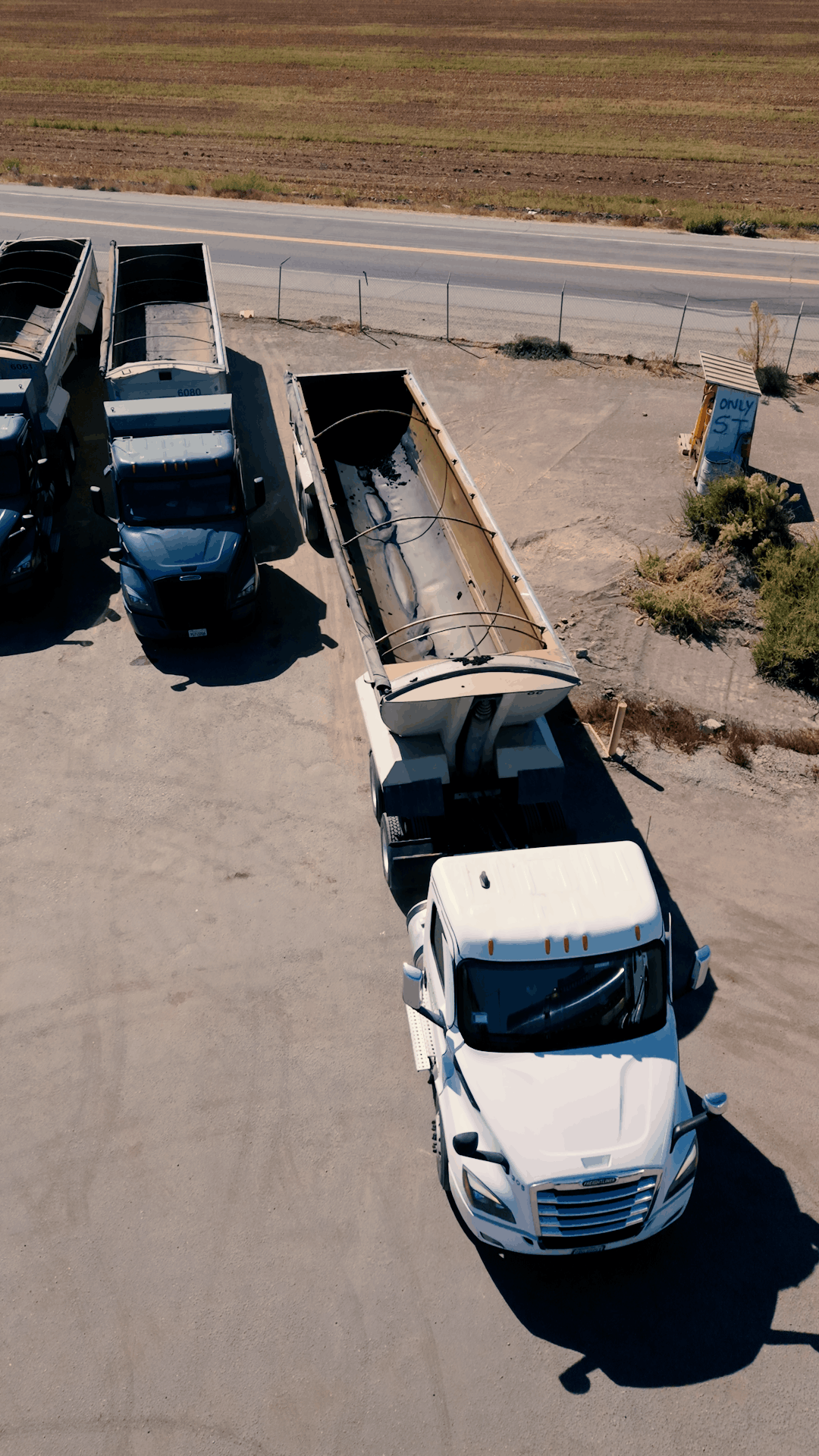 Aerial view of an All Seasons Logistics end-dump truck